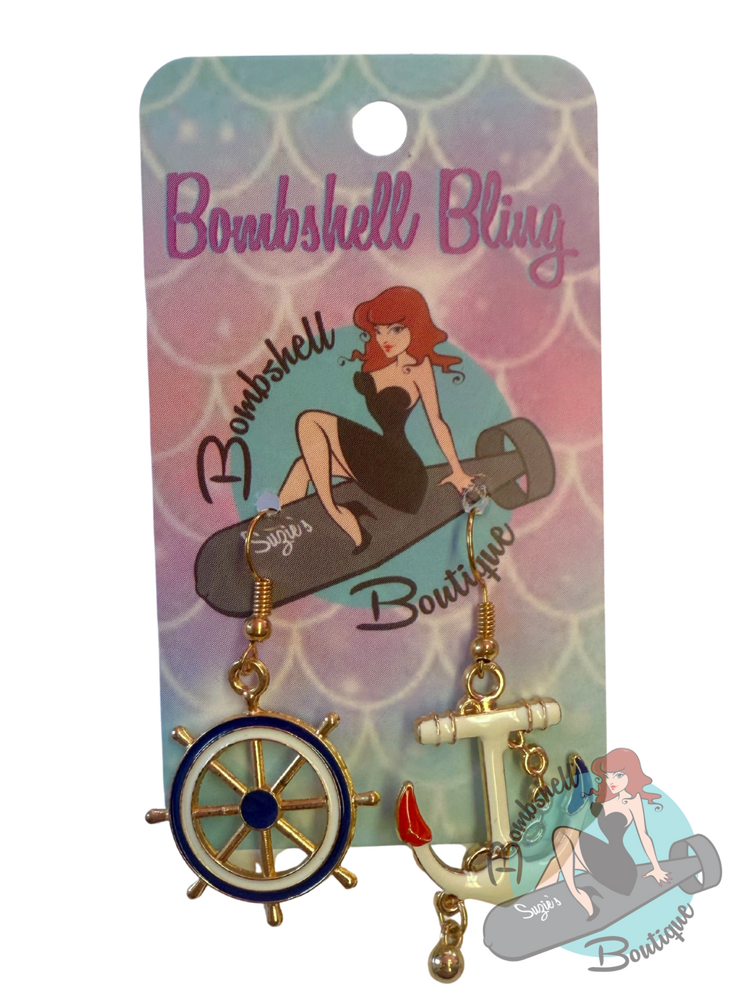 Earring set with anchor and wheel design on a 'Bombshell Bling' branded card.