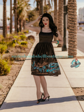 Boulevard Nights Viva Las Vegas Border Print Dress black shiny strappy dress with design of vegas on the skirt vintage retro pinup 40s 50s swing dress with pockets Canadian Pin-Up Shop Suzie's Bombshell Boutique