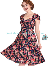 Voodoo Vixen Canada Voodoo Vixen Day of the Dead Flare Dress is a retro 1940s 1950s flared swing dress with skulls and roses gothic floral design with pockets altfashion rockabilly spooky pinup Canadian Pin-Up Shop Suzie's Bombshell Boutique