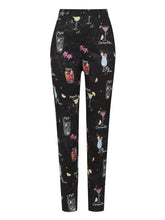 Collectif Maddie Cocktail Menu Trousers Collectif Canada black cigarette pants with pictures of tiki drinks on them highwaisted pants for women retro vintage pinup 40s 50s rockabilly pants Canadian Pin-Up Shop Suzie's Bombshell Boutique