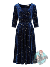 Navy blue dress with star and moon pattern on a white background