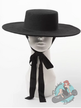 Gothic style black flat top wide brim hat for women who like to dress in vintage pinup or goth style.