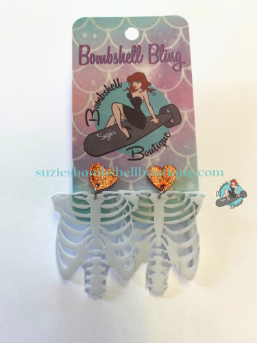 Bombshell Bling Skinny Love Earrings acrylic earrings of skeleton hanging from sparkly red hearts goth pinup halloween altfashion resin costume jewellery Canadian Pin-Up Shop Suzie's Bombshell Boutique