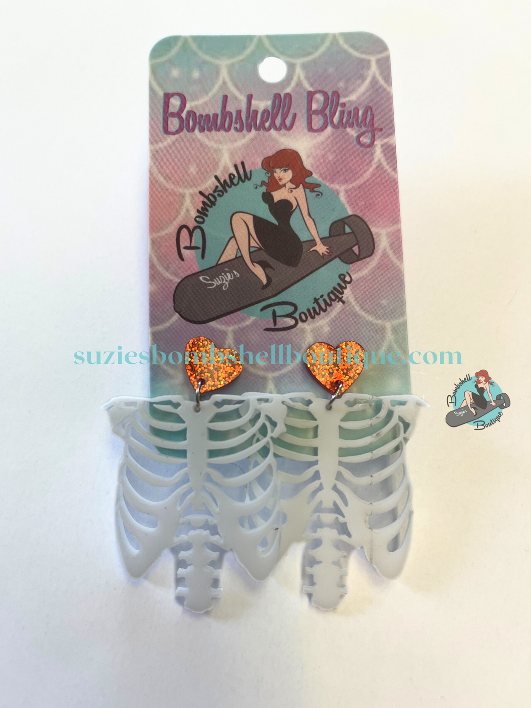Bombshell Bling Skinny Love Earrings acrylic earrings of skeleton hanging from sparkly red hearts goth pinup halloween altfashion resin costume jewellery Canadian Pin-Up Shop Suzie's Bombshell Boutique