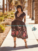 Boulevard Nights Custom Spanish Floral Border Print Dress Rockin Bettie Elle Rebel black shimmery satin sundress with v neck short sleeves pockets and full swing skirt with gathers retro vintage 40s 50s pinup rockabilly fashion ladies dress Canadian Pin-Up Shop Suzie's Bombshell Boutique