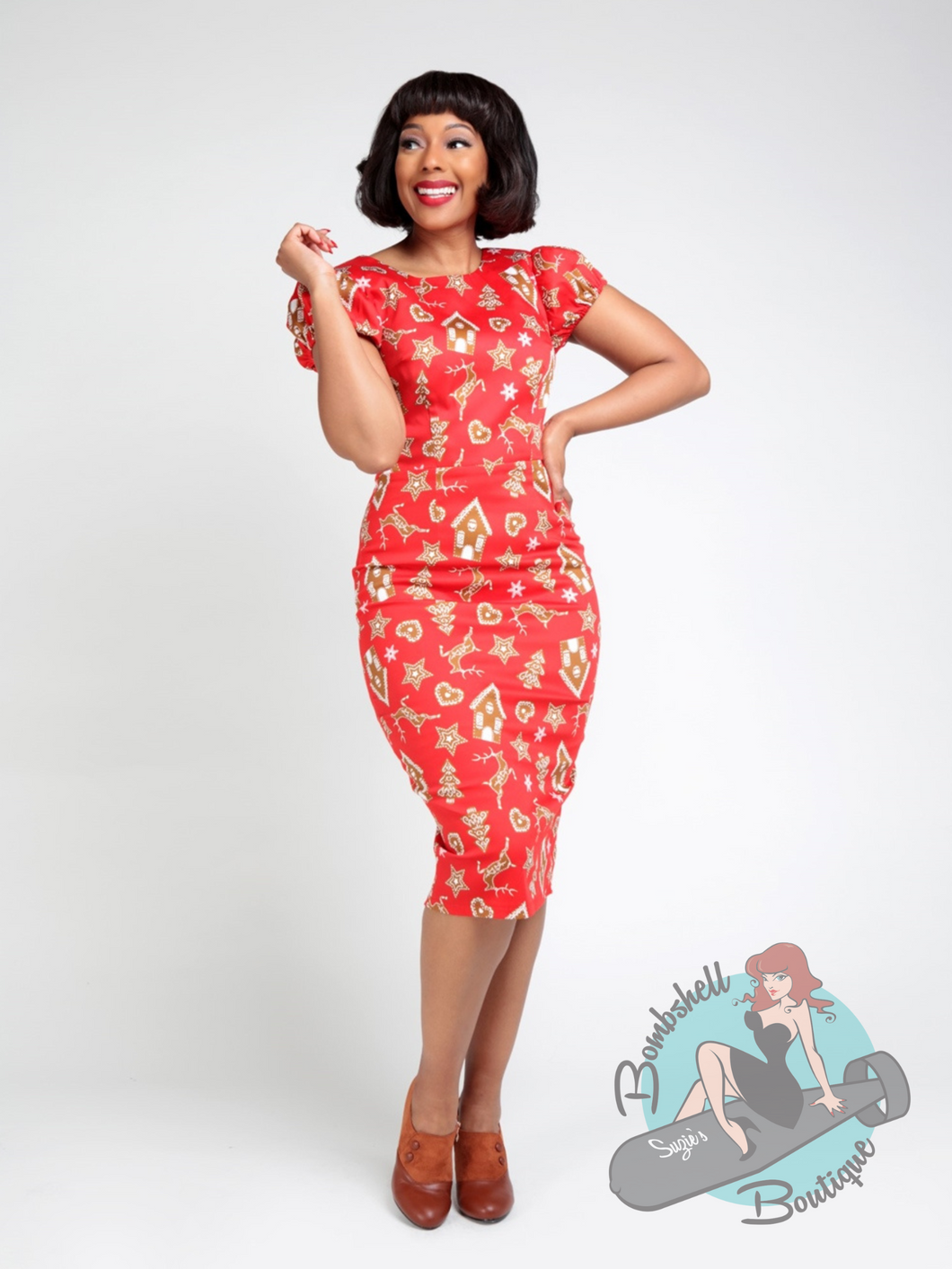 Red pencil dress with print of gingerbread cookies. This is a cute Christmas wiggle dress - a perfect holiday dress for a 1950's pin up look.