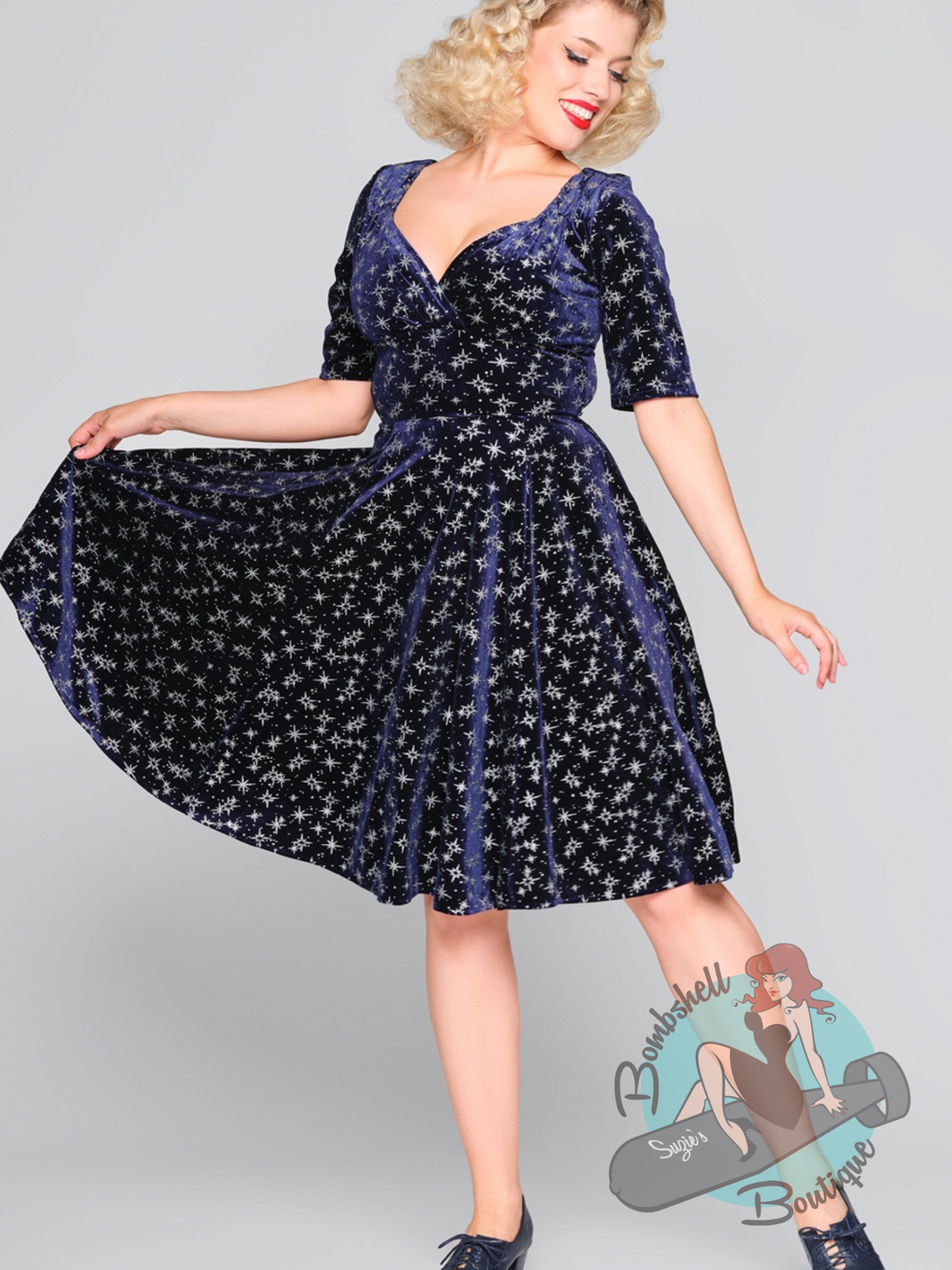 Blue velvet holiday swing dress with silver sparkle design. A perfect pin up Christmas party dress.
