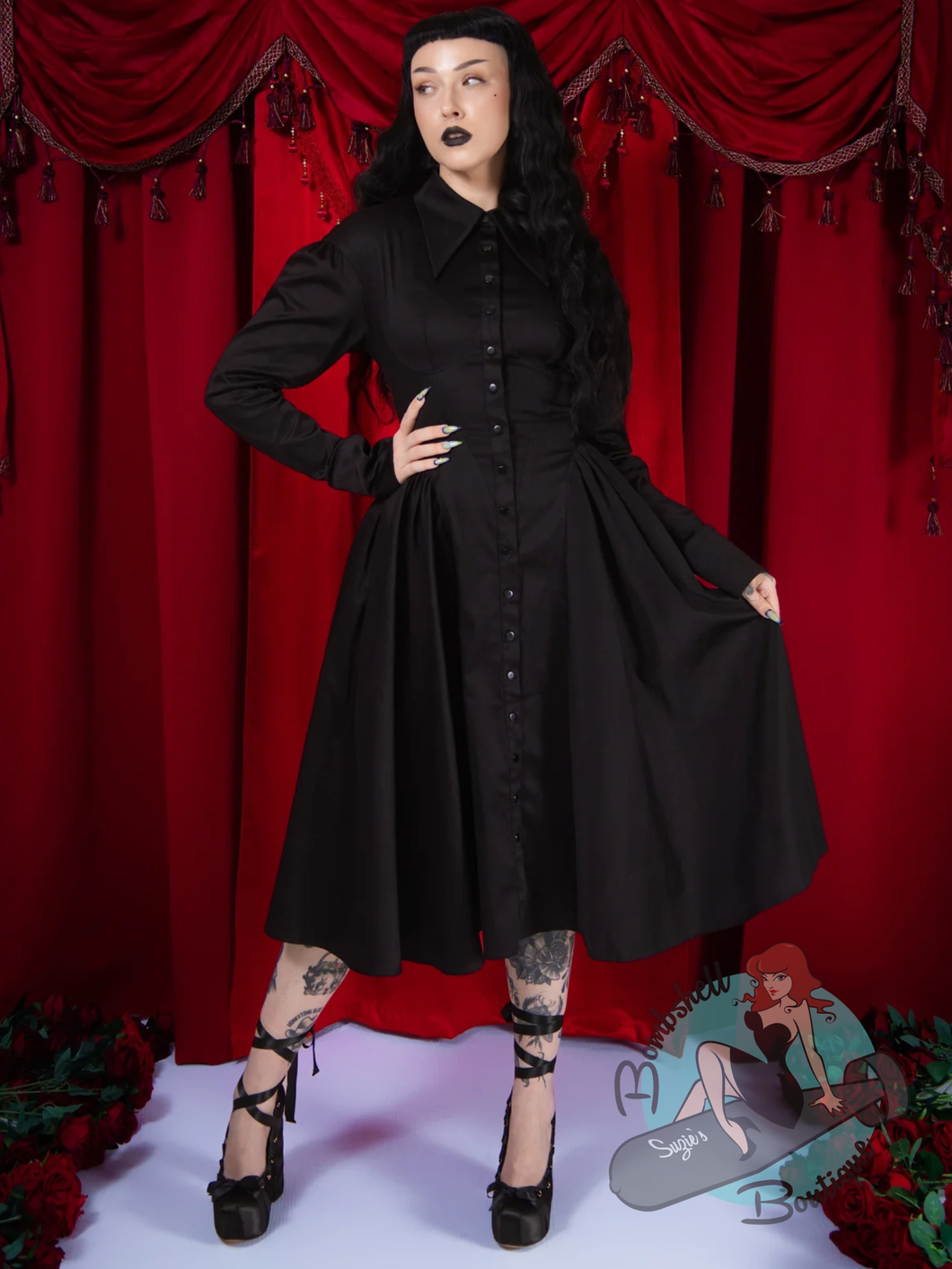 pinup woman wearing black Elle Rebel Canada goth clothing swing dress