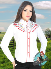 Woman wearing white western shirt embroidered with red flowers