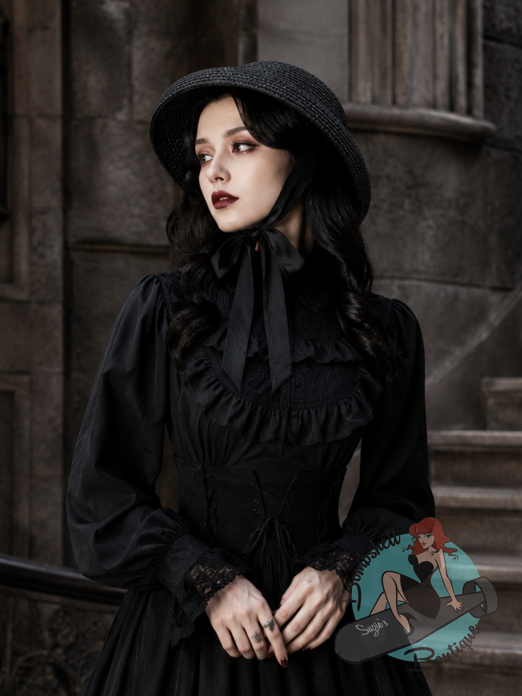 Gothic woman in a black outfit with a lolita style hat.
