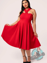 Pinup woman wearing hell bunny canada red classic swing dress
