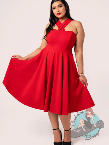 Pinup woman wearing hell bunny canada red classic swing dress