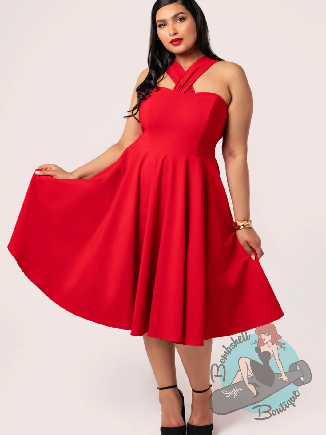Pinup woman wearing hell bunny canada red classic swing dress