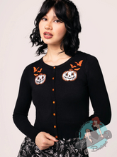 goth pinup girl wearing black knitted cardigan with halloween embroidery