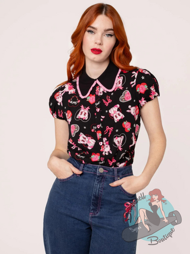 Pinup girl wearing valentines spooky blouse in black and pink