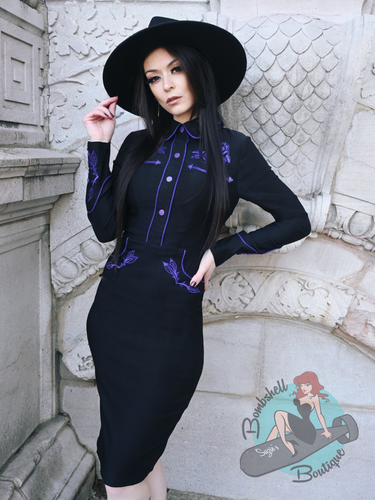Pinup girl in southern gothic style black western dress with purple embroidery 