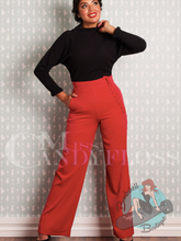 Pinup girl wearing 1940s style vintage trousers