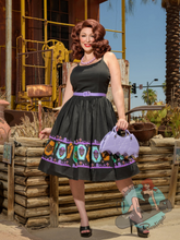 Black cotton dress with b movie monster print along the border of the skirt. Goth pinup or rockabilly style swing dress.