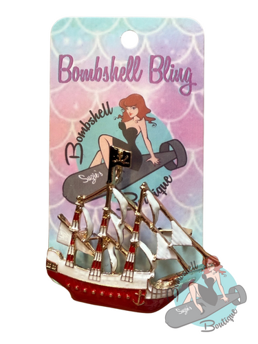 Pin with ship design on a 'Bombshell Bling' branded card