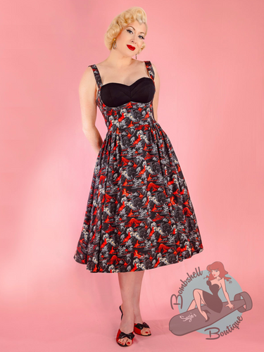 Blonde pinup girl, Miss Audrey Monroe, wearing Rebel Love 1950s vintage style swing dress in black and red volcano print.