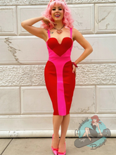 Pink and red wiggle dress in bandage dress fabric featuring a heart shaped bodice for Valentine's. A bright fun summer pinup dress.
