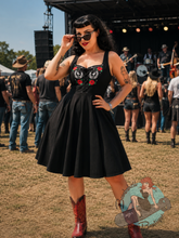 rockabilly pinup wearing hell bunny canada black gothic western swing dress