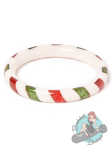 Narrow white Christmas bangle with green and red candy stripe design. Perfectly accessorize your pin up holiday dress.