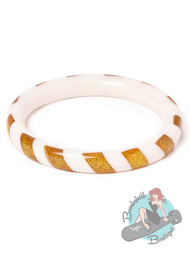 White Christmas bangle in style of bakelite, with gold glitter candy striped design. Perfectly accessorize your pin up holiday dress.
