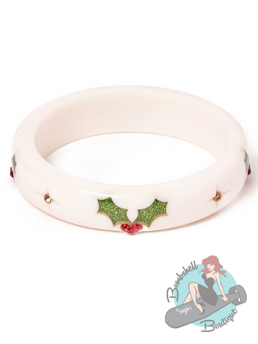 A medium width white christmas bangle with sparkly holly and starburst gem design. Perfect for accessorizing your pin up holiday dress.