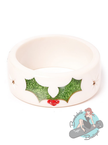 Wide white bangle with glittery holly christmas design. A perfect accessory for your vintage christmas pin up look.