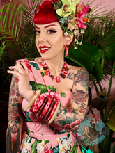 Pinup girl My Fair Munster wearing tiki dress with Splendette vintage style bangles