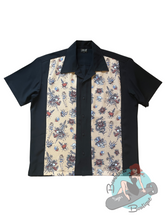 Short sleeved men's black button up with tattoo print panels. The perfect shirt for greaser guys, rockabillies, and trad tattoo lovers.