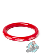Hot pink tiki bangle in vintage bakelite style