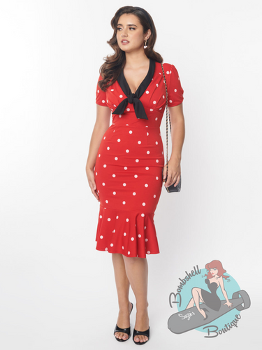Red stretch wiggle dress with white polka dots and black tie neckline. A vintage inspired 1950s style pin up dress with mermaid skirt.