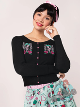 pinup girl wearing black cardigan with western queen of the rodeo embroidery