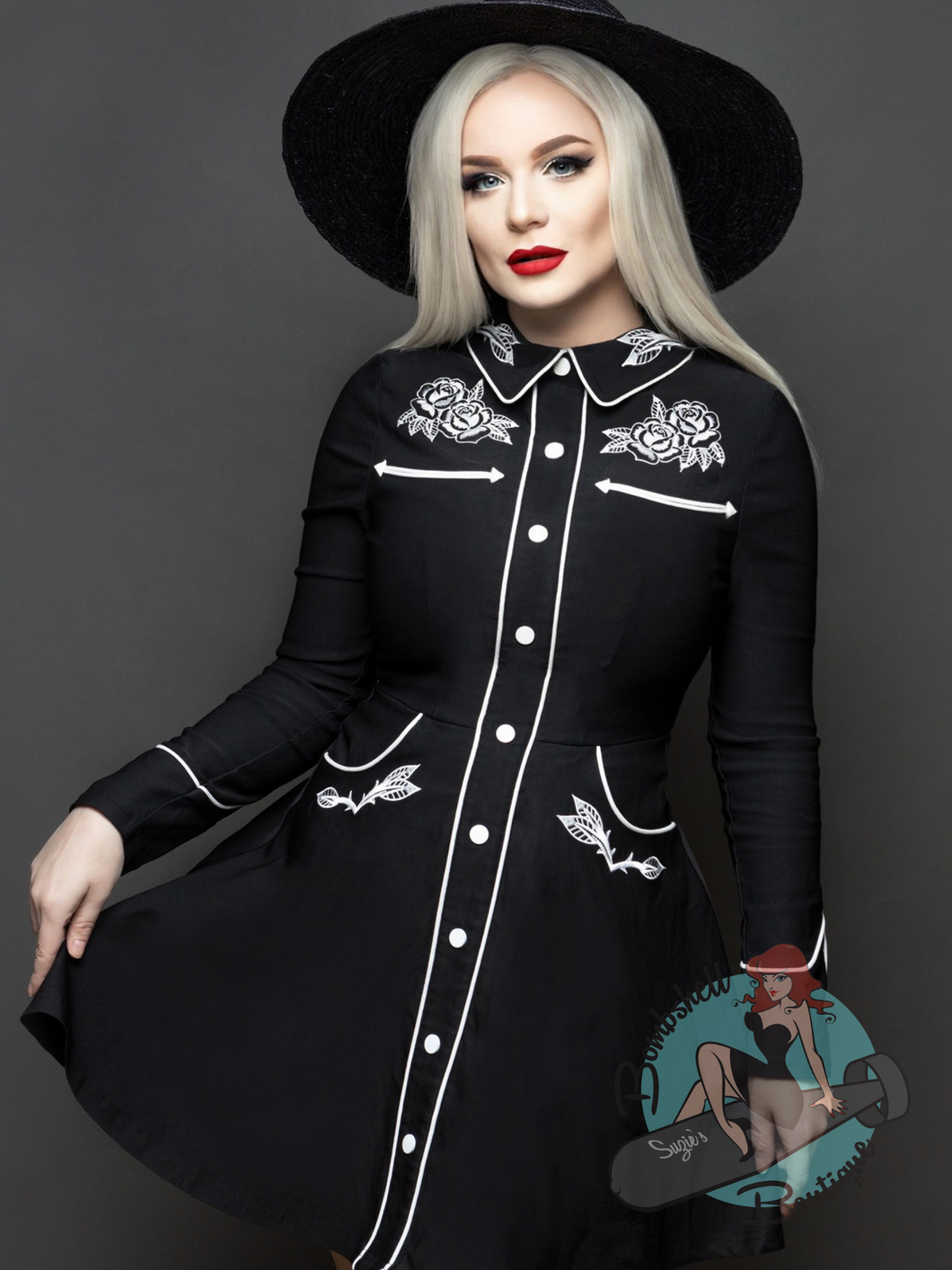 Short black Western swing dress with white roses embroidery and pockets. Perfect for a pinup rockabilly or rodeo event.