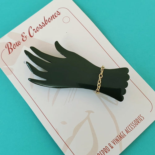 Bow & Crossbones Lillianna Hand Brooch Black Bow and Crossbones Canada black acrylic hand with gold chain art deco retro vintage pinup 40s 50s bakelite jewellery Canadian Pin-Up Shop Suzie's Bombshell Boutique Port Dover