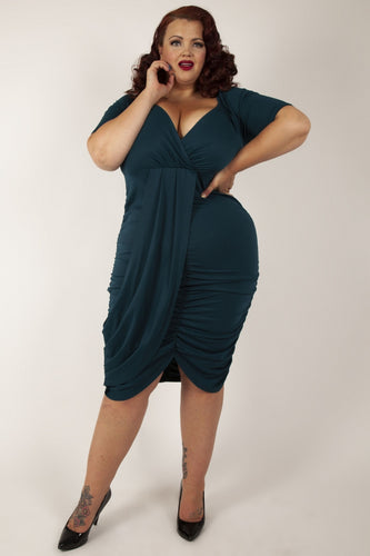 Voodoo Vixen Curve Georgina Wrap Bodycon Dress Green Voodoo Vixen Canada dark green plus size cocktail dress with v neck three quarter length sleeves and rouched front sexy retro vintage pinup 40s 50s wiggle dress pencil dress Canadian Pin-Up Shop Suzie's Bombshell Boutique Port Dover