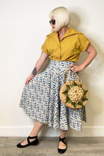 The Oblong Box Shop School of Fish Circle Skirt TOBS Canada white hight waisted swing skirt with blue yellow and green mcm design of fish retro vintage pinup 40s 50s poodle skirt tiki rockabilly fashion Canadian Pin-Up Shop Suzie's Bombshell Boutique Port Dover